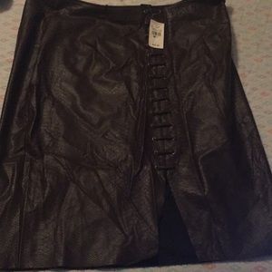 Brown skirt with a small cut .